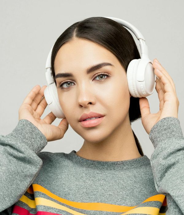 Young woman looking into the distance with relaxed expression